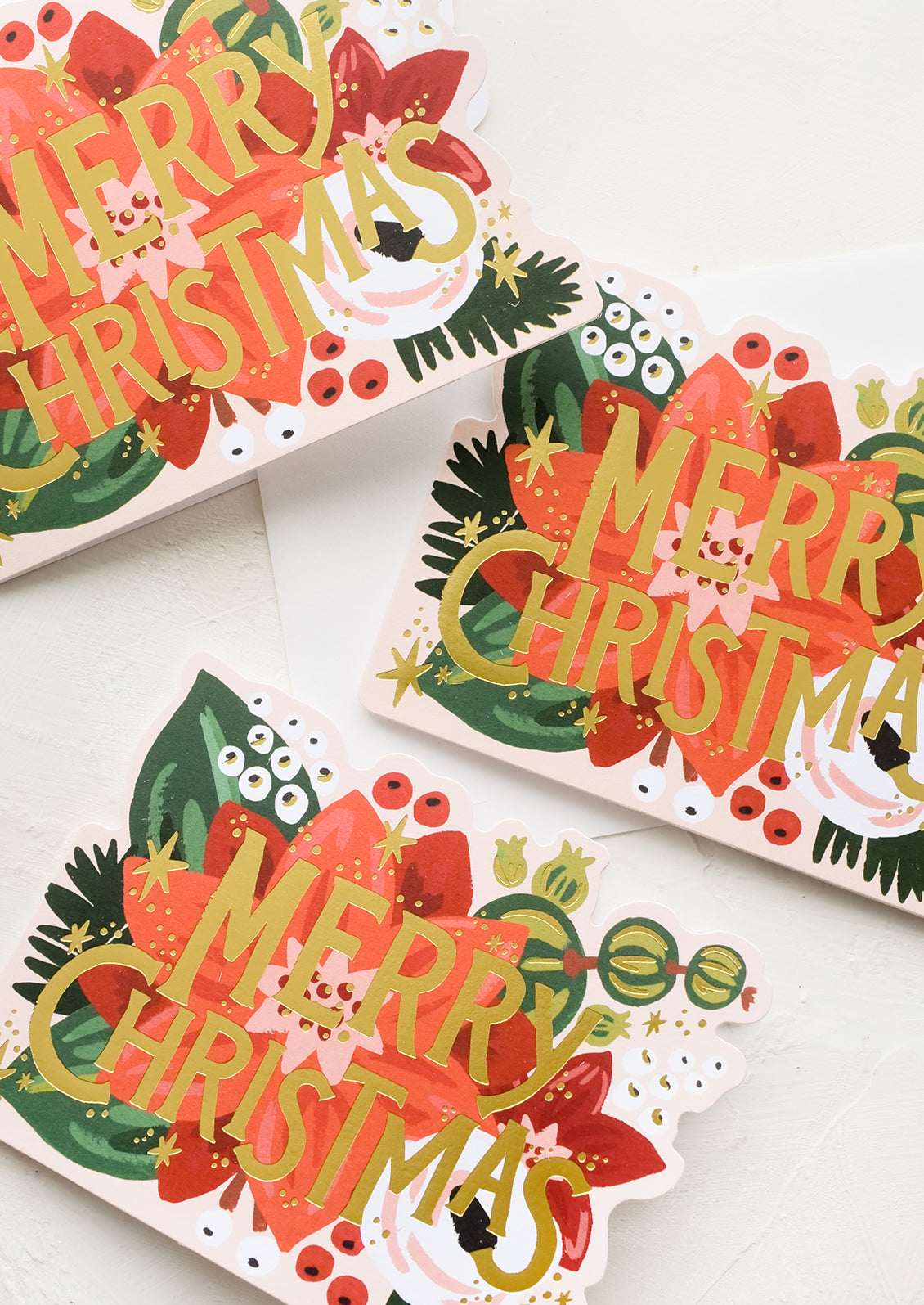 Three diecut christmas cards in poinsettia design.