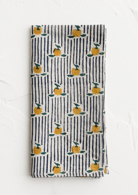 A block printed cotton napkin in stripe and floral pattern.