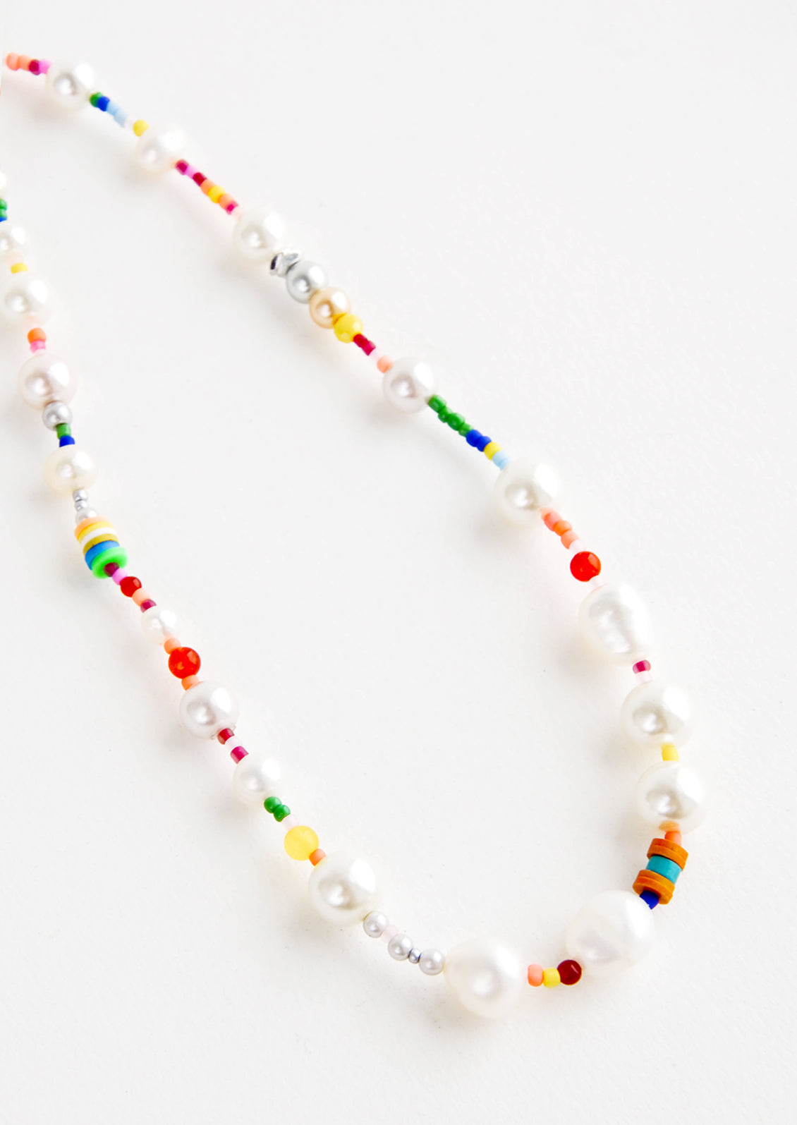 Mix of chunky pearl beads with rainbow colored beads on single strand necklace