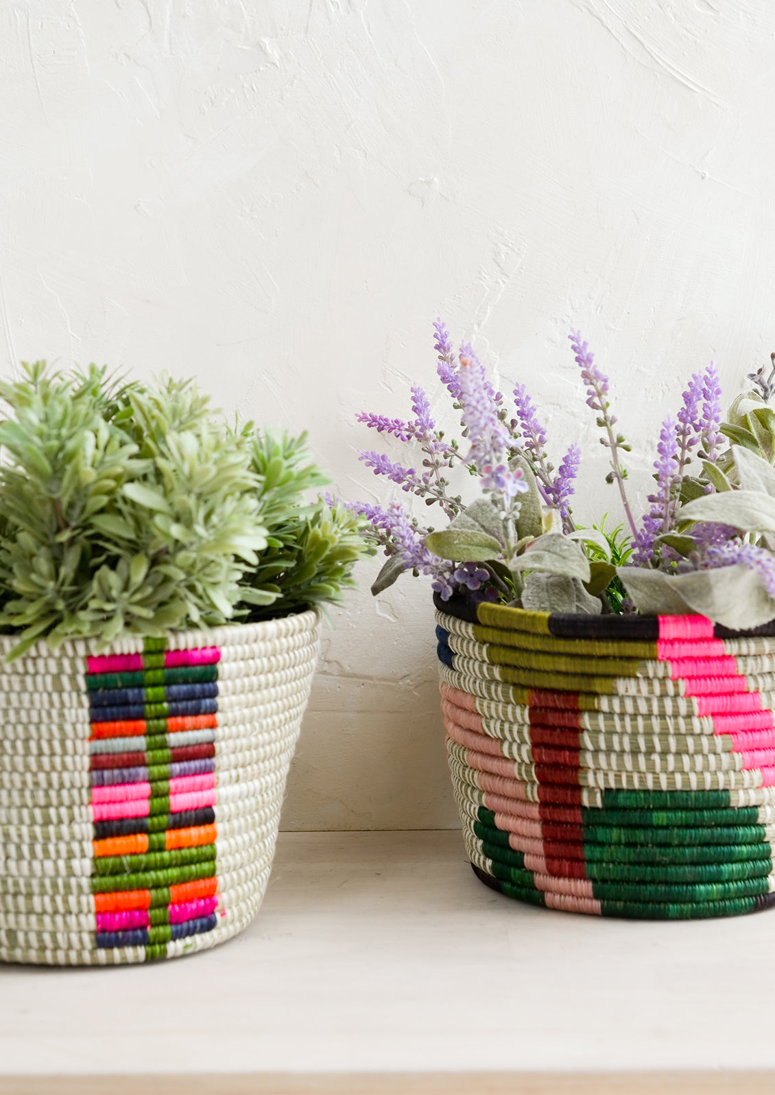 Colorful woven round planter baskets.