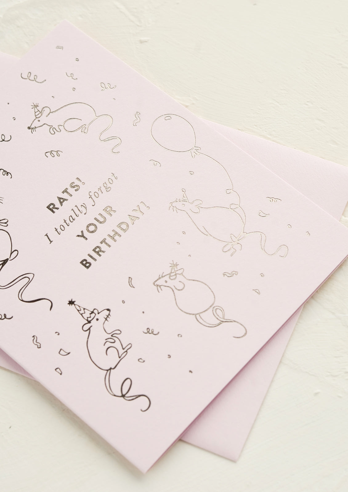 A greeting card with silver foil printing.