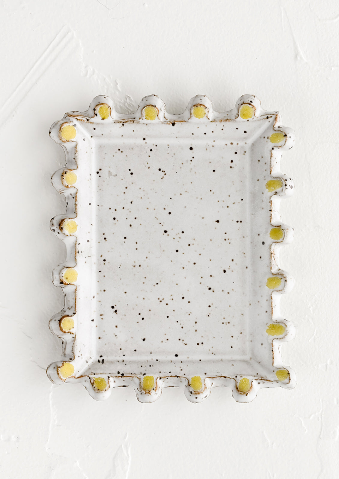 A rectangular ceramic dish with decorative trim.