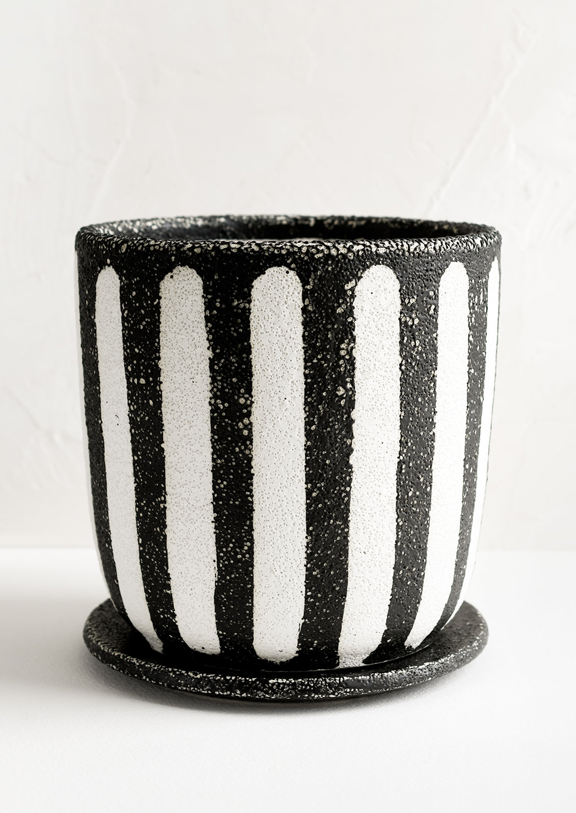 A black and white striped planter.