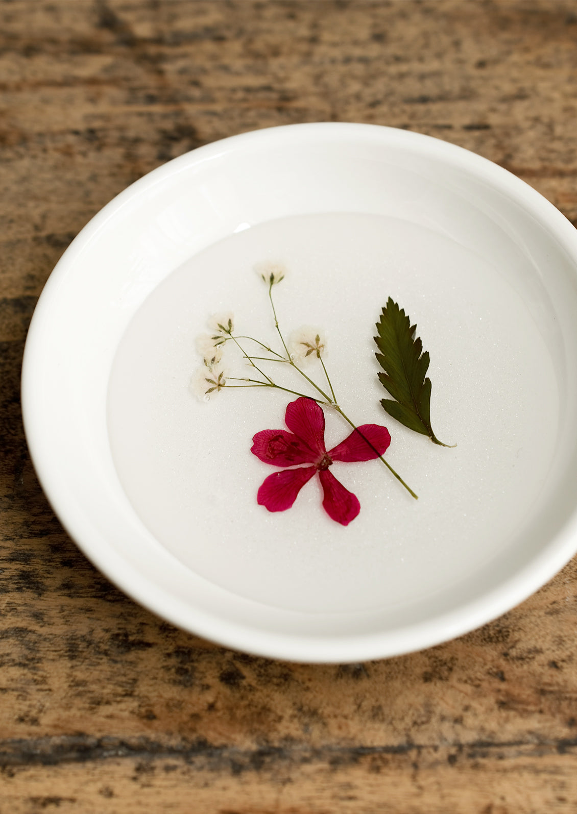 A pressed flower ring dish.