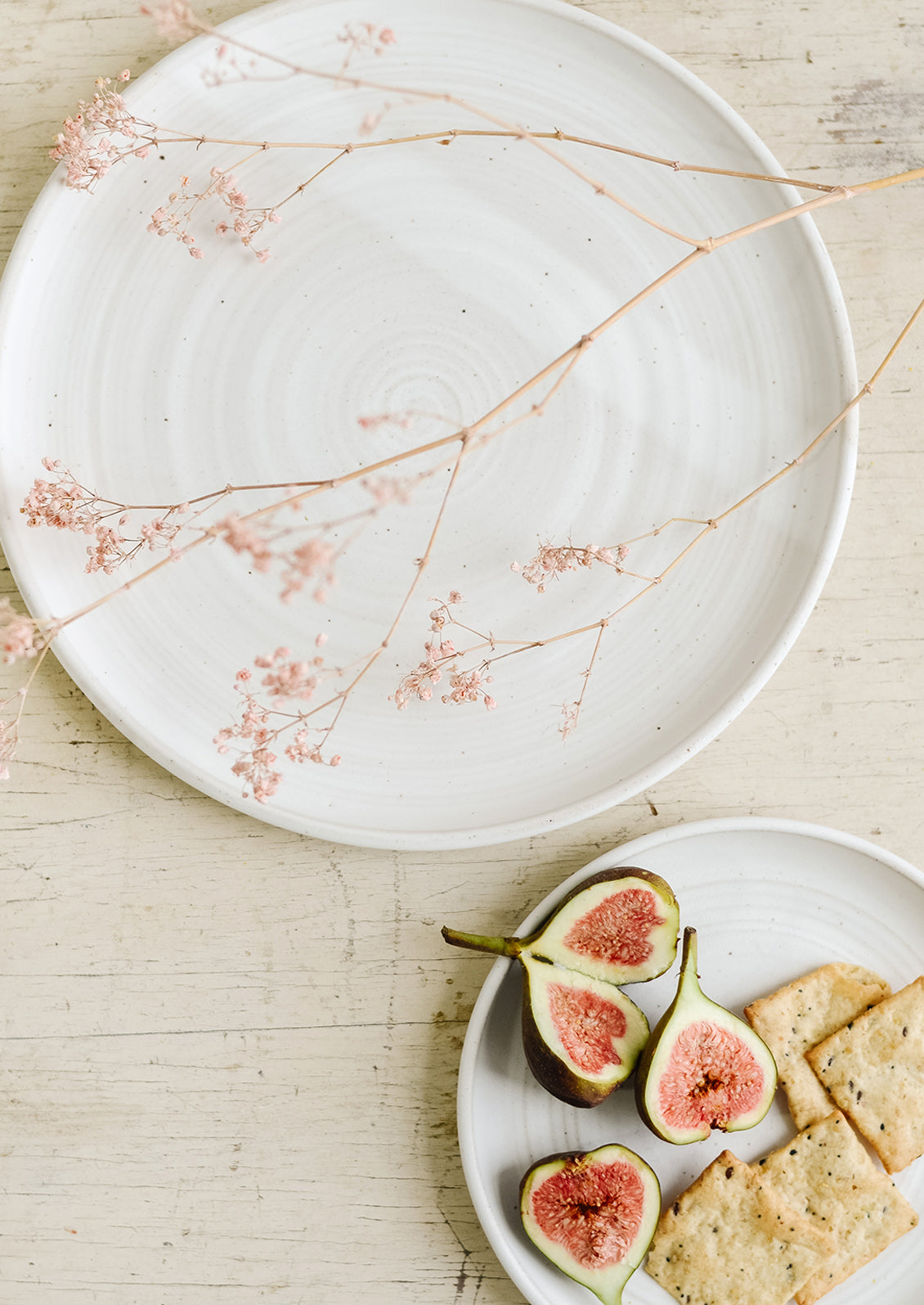 Matte white ceramic plates in dinner and dessert sizes.