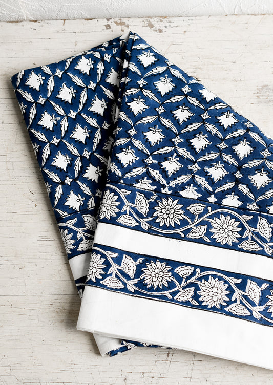 An indigo and white block printed tablecloth.