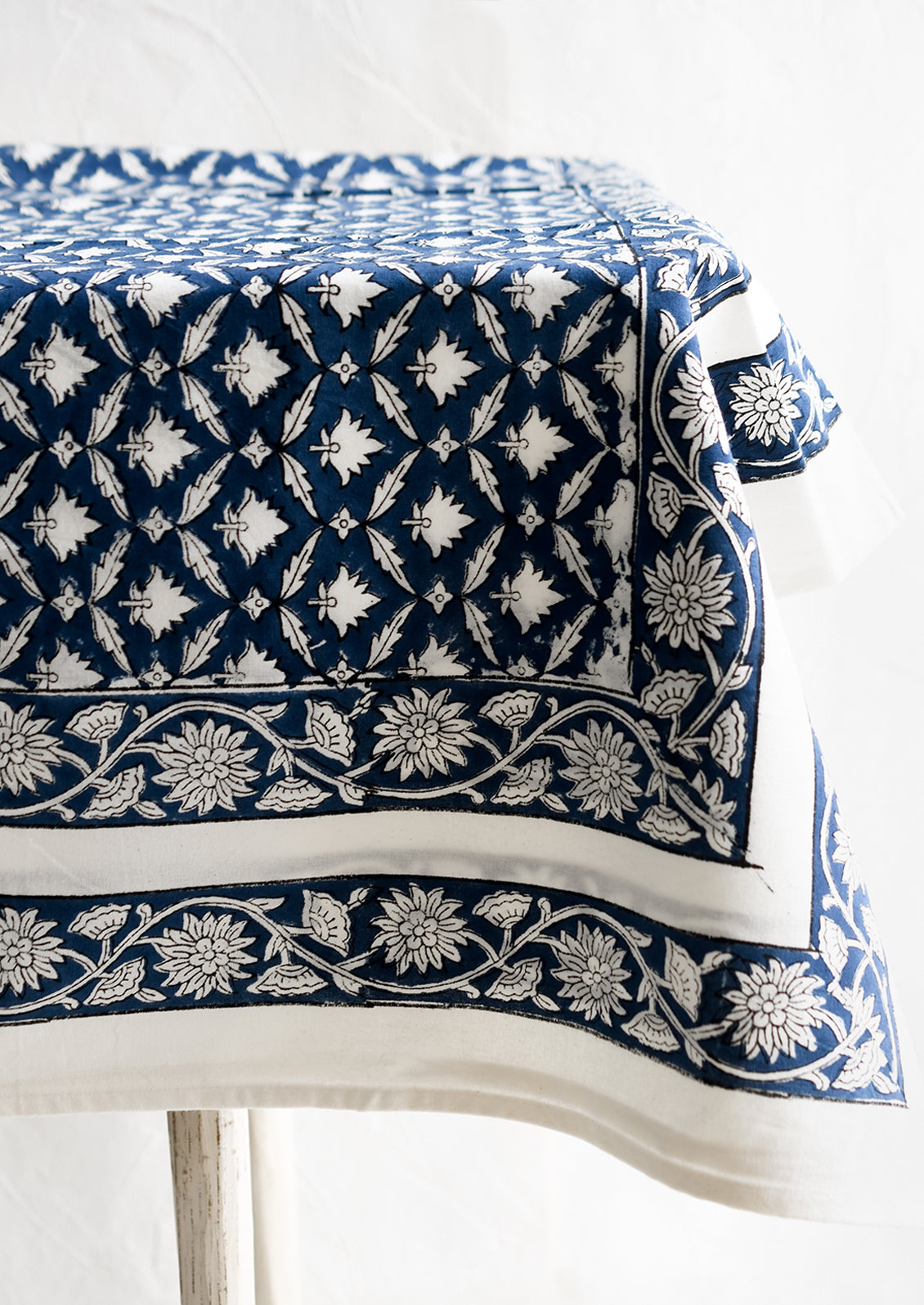 An indigo and white block printed tablecloth.