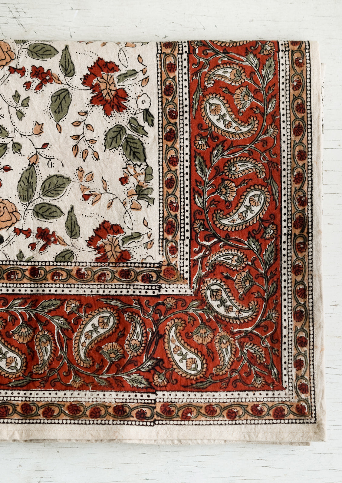 A block printed tablecloth in floral and paisley print.