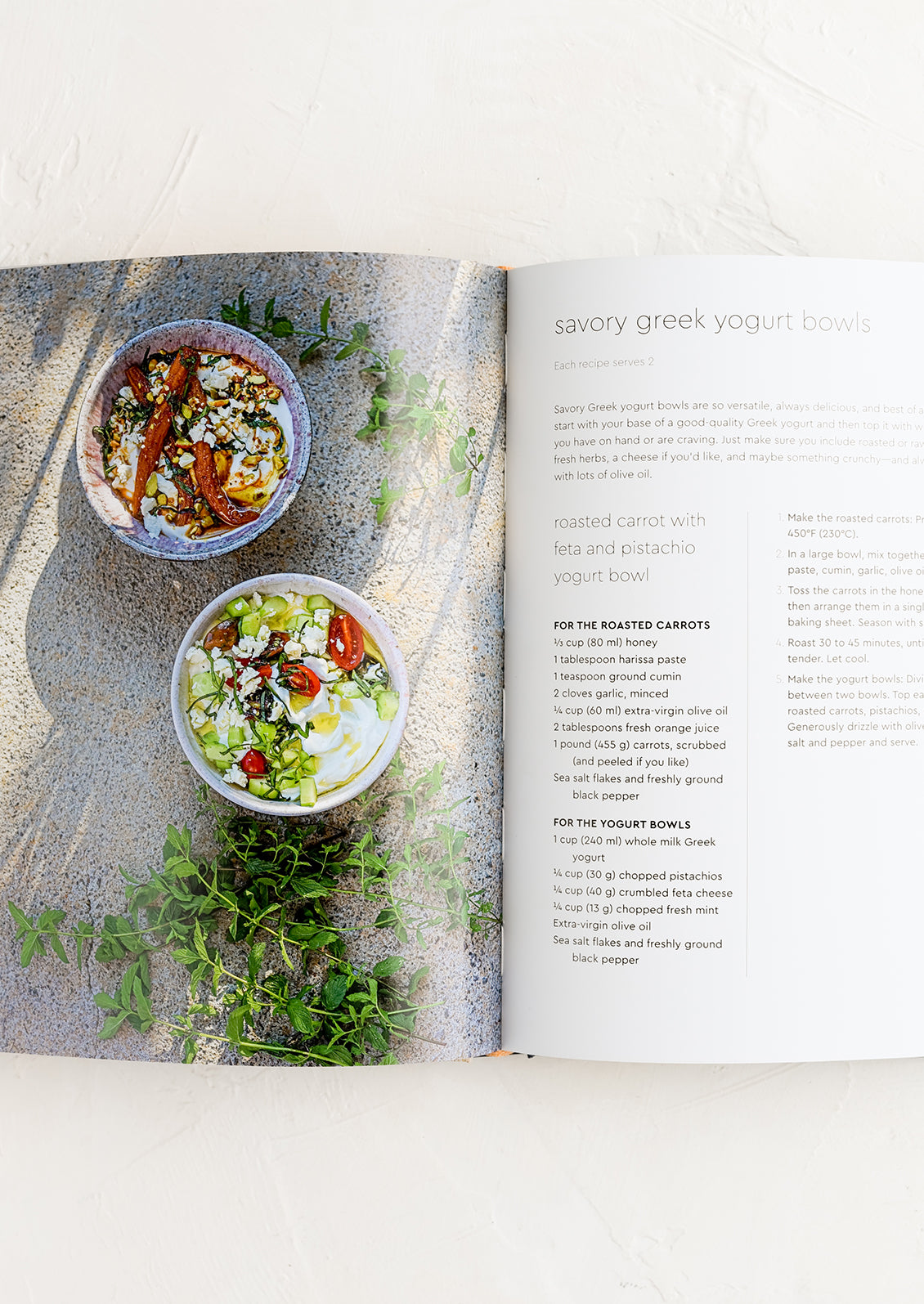 A cookbook open to a page with recipe for savory greek yogurt bowls.