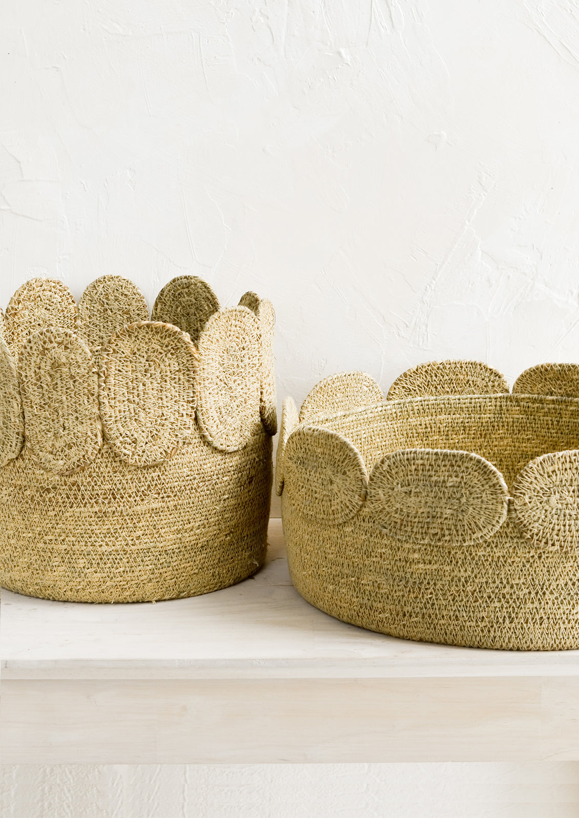 Two seagrass storage baskets in low and tall sizes.