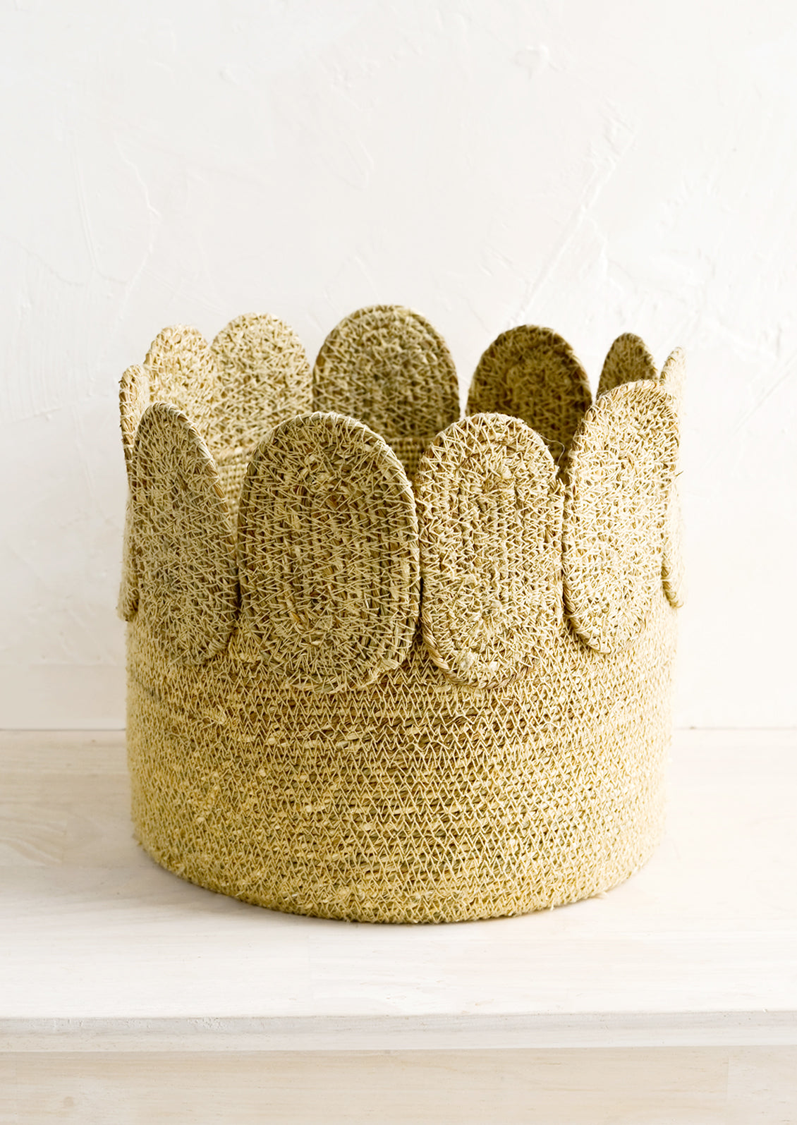 A circular seagrass storage basket.