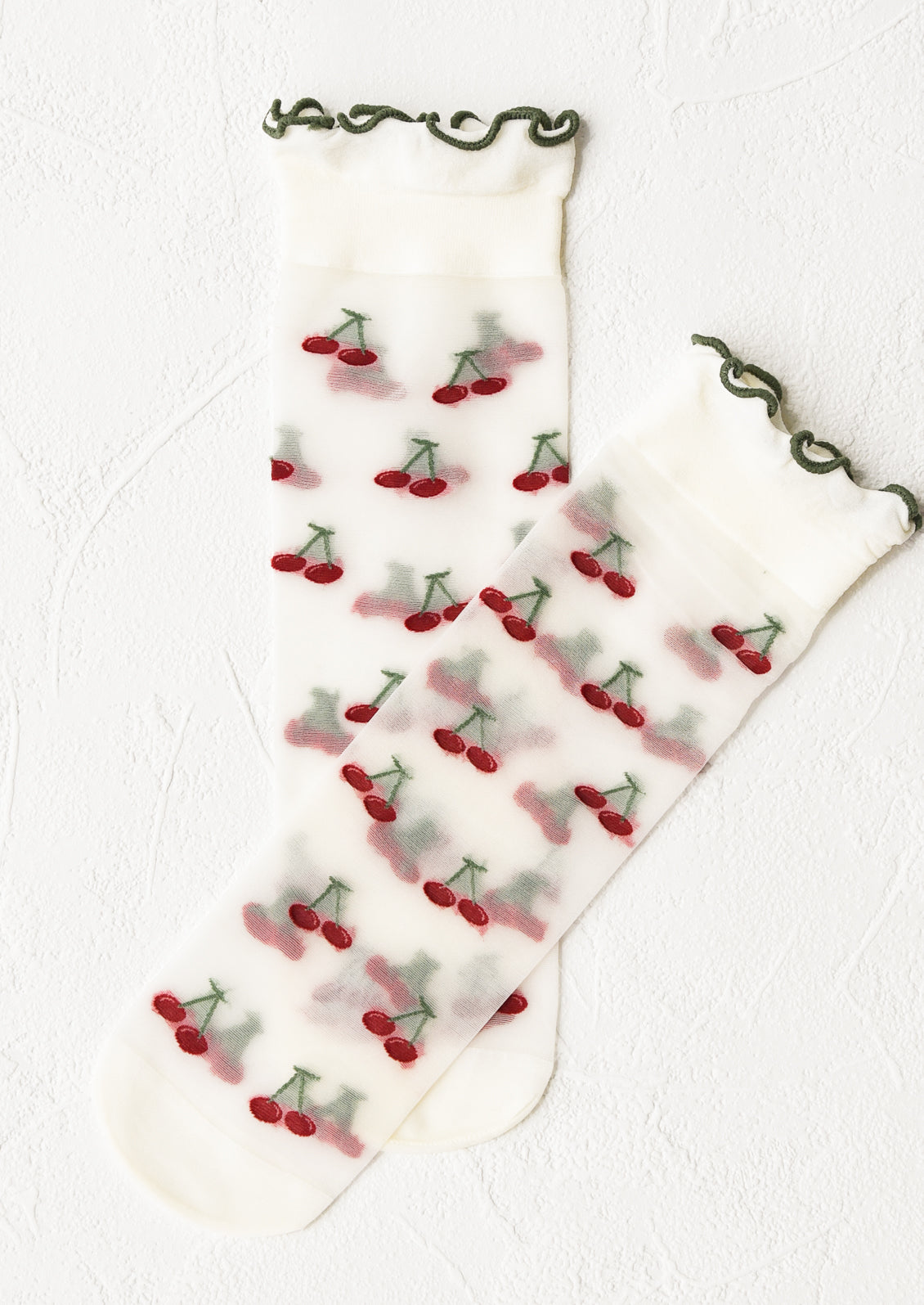 Sheer socks with cherry print and ruffled green ankle.