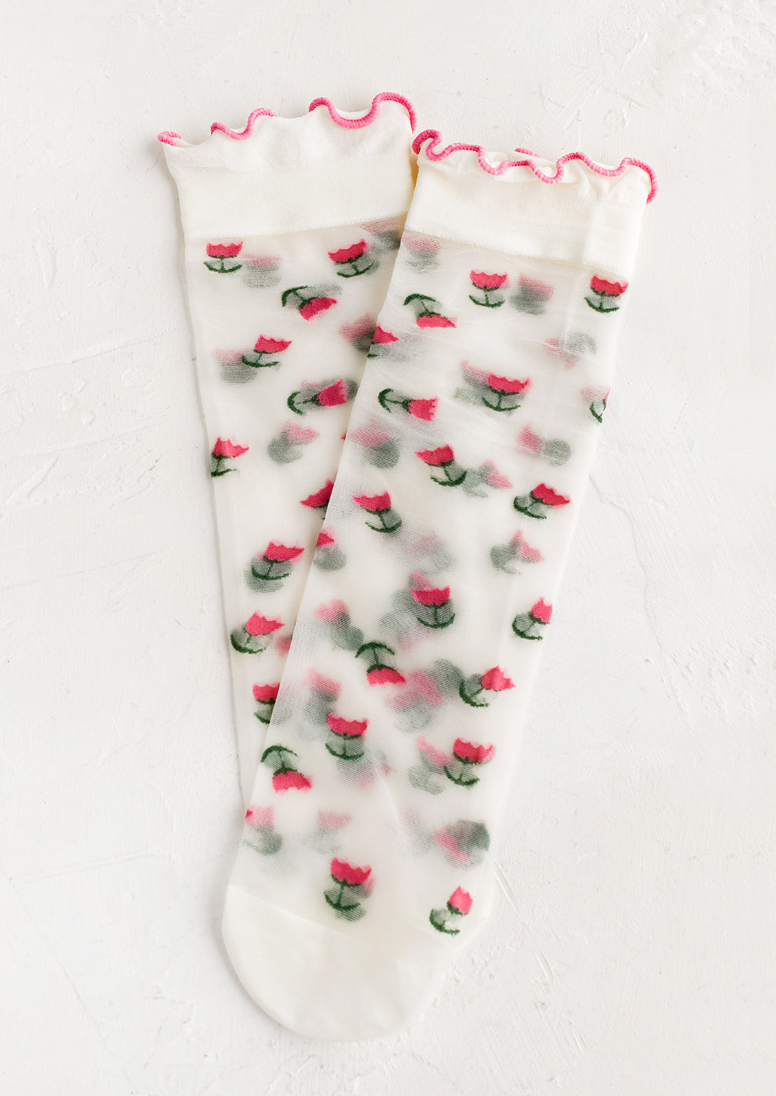 Sheer socks with tulip print and ruffle pink ankle.