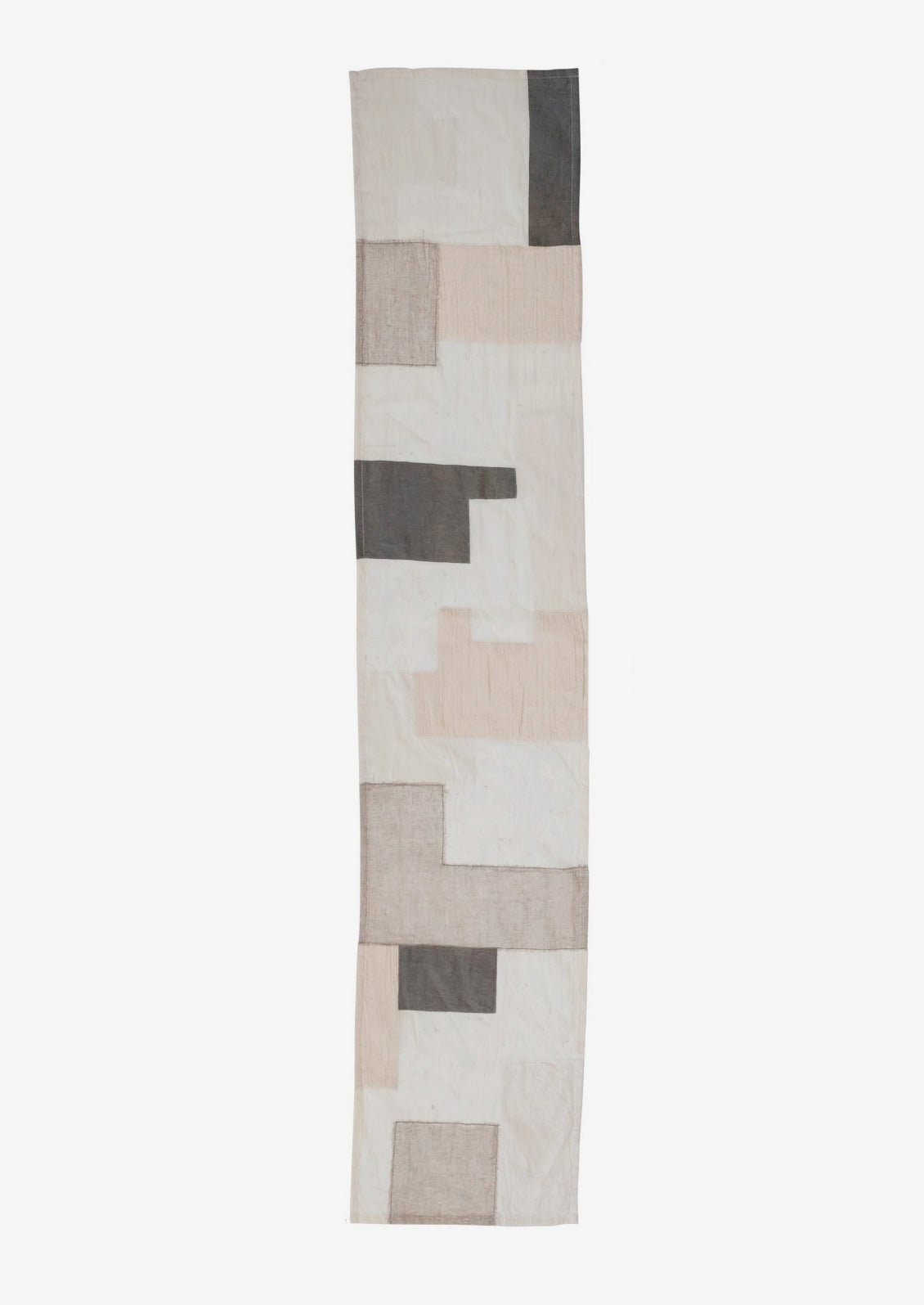 A patchwork runner in sheer patchwork design.