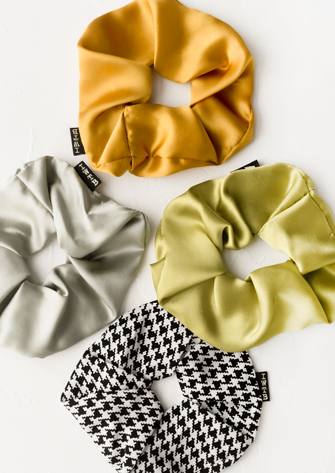 Silk scrunchies in assorted colors.