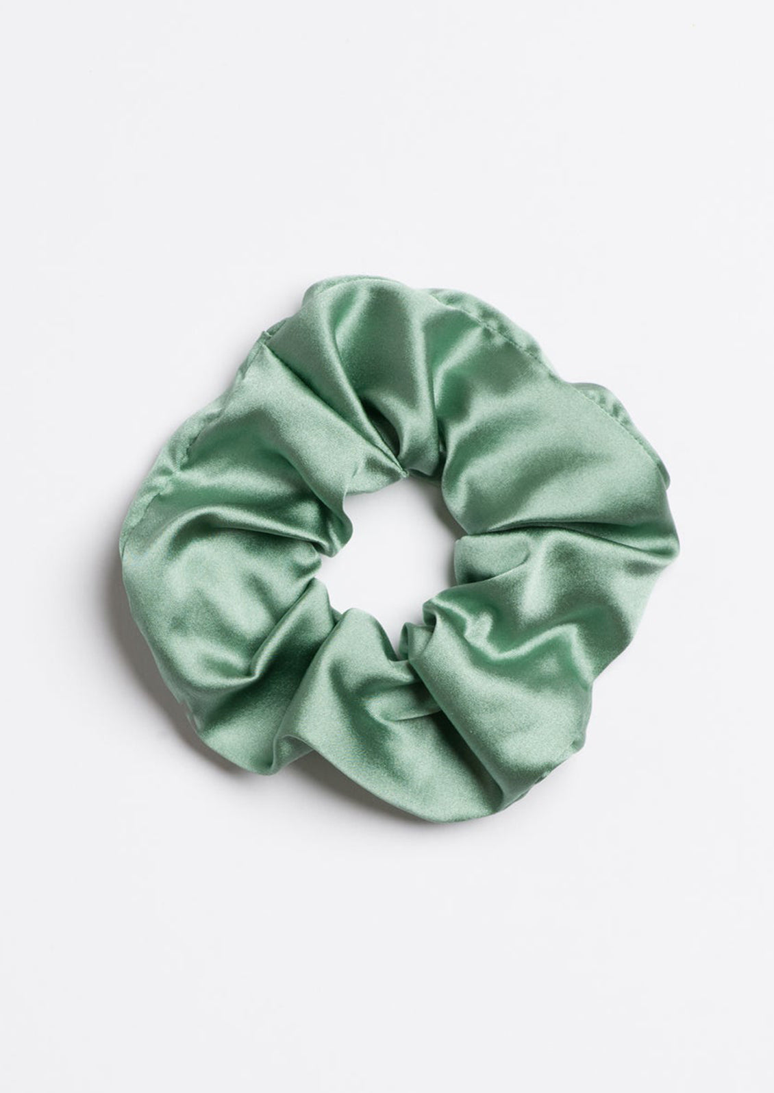 A silk scrunchie in seafoam.