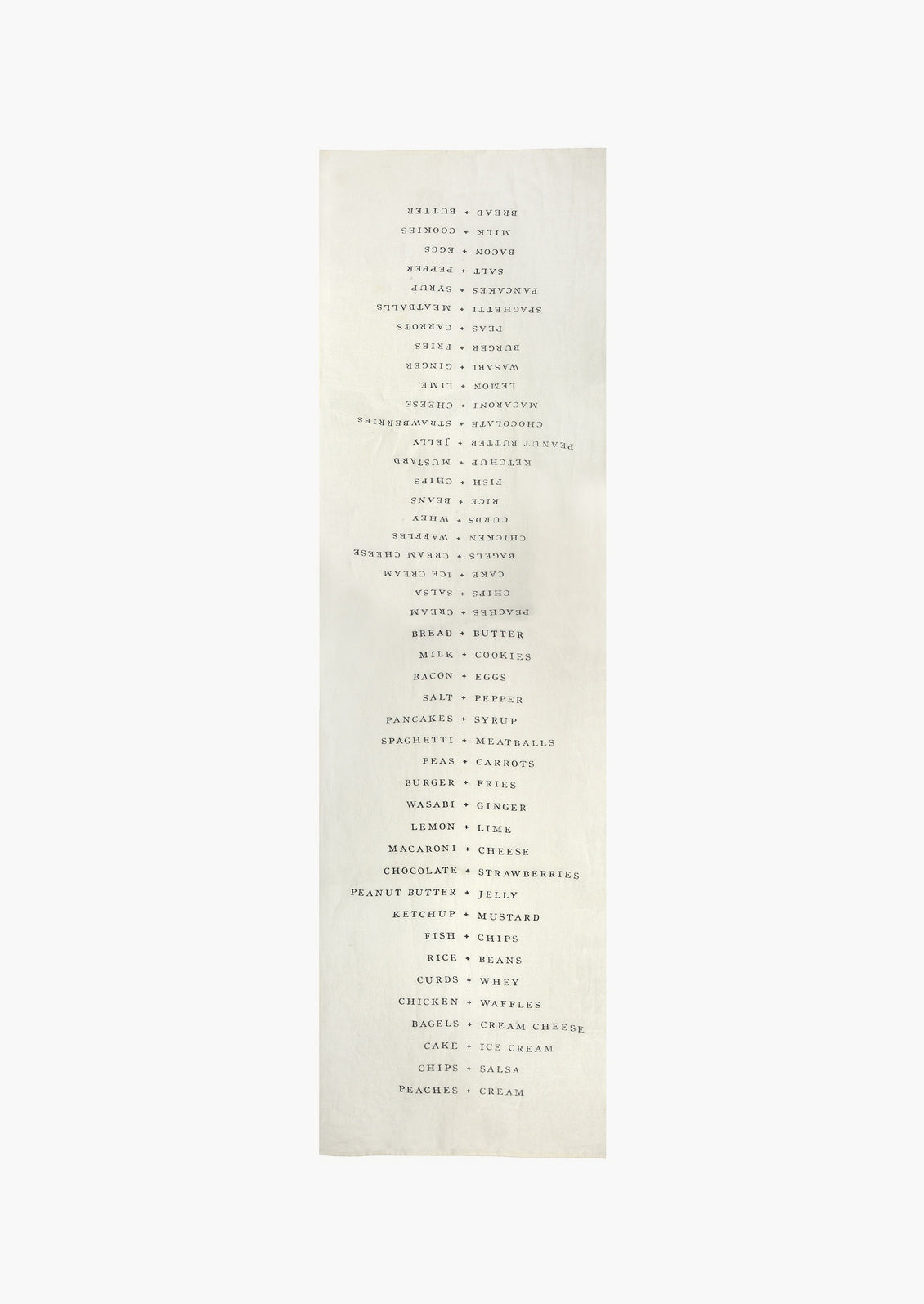 A white table runner with names of food pairings listed opposite each other.
