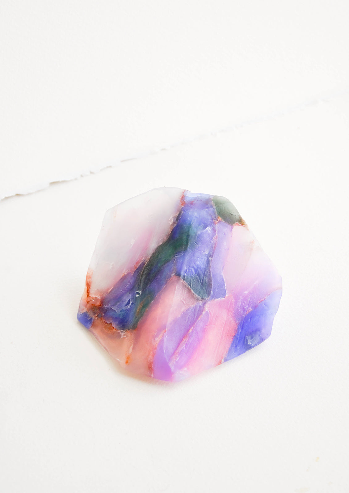 Bar soap in the form of a realistic looking opal gemstone