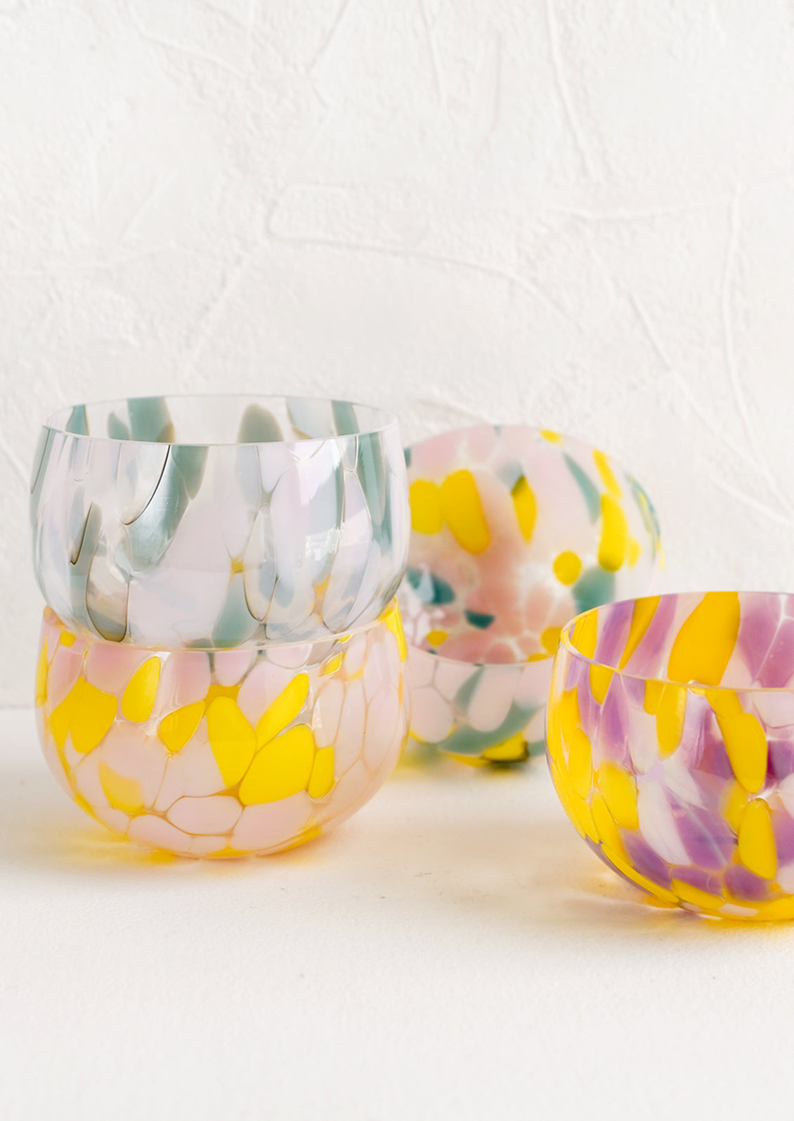 Speckled glass bowls in assorted colors.