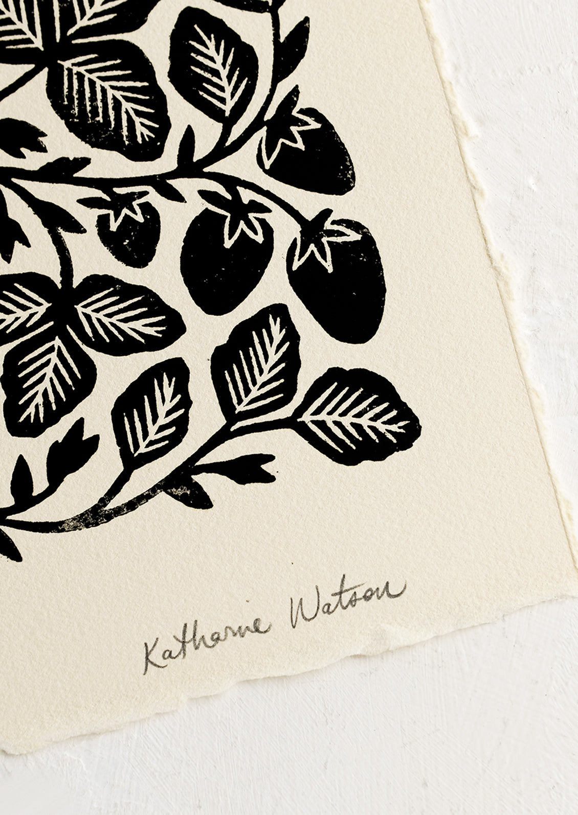 Artist's signature on strawberry woodcut print.