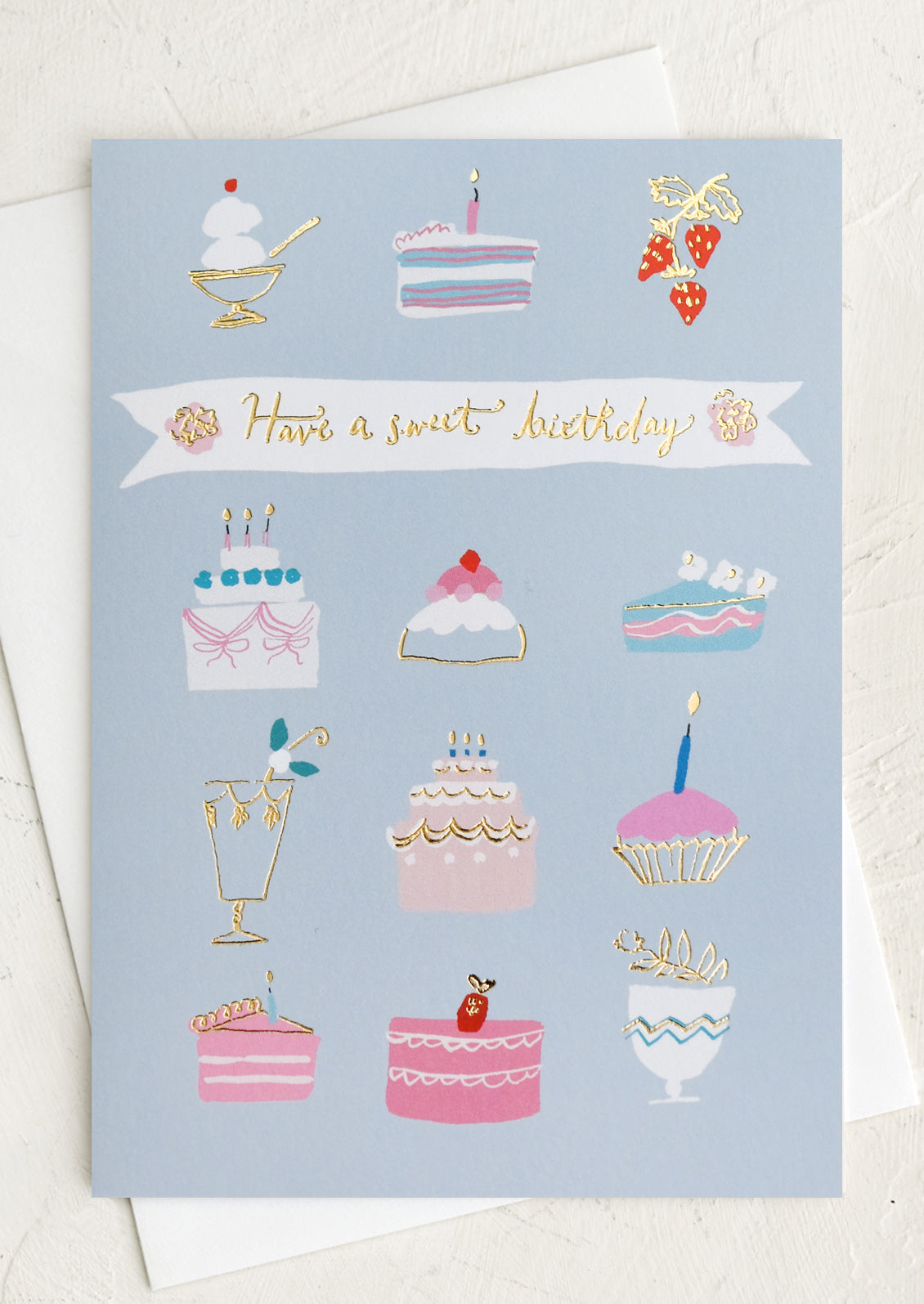 A greeting card with images of various desserts, text reads "Have a sweet birthday".
