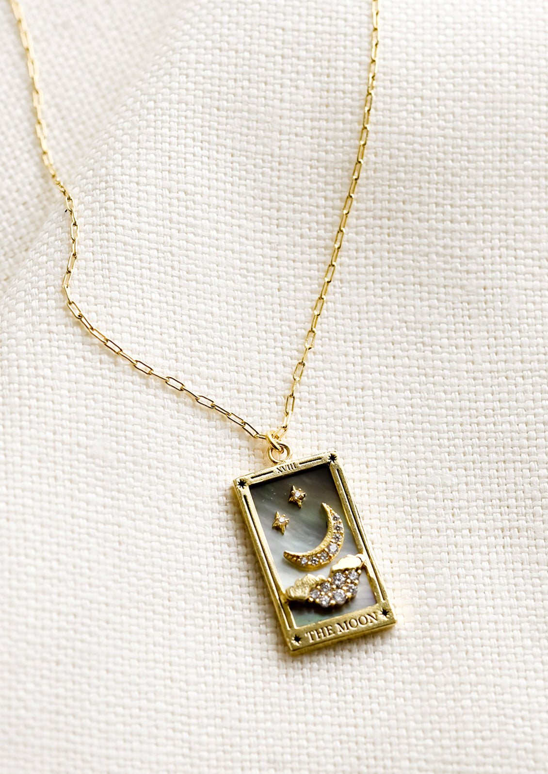 A necklace in style of Moon tarot card.
