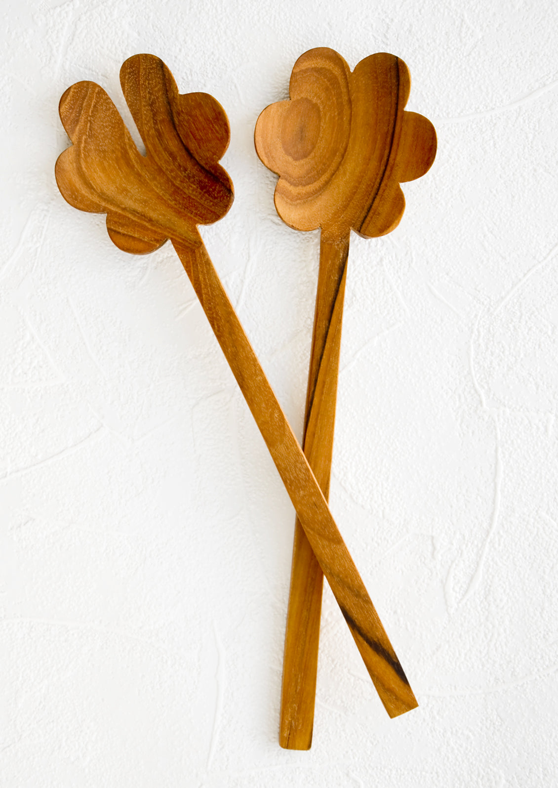 Pair of wooden, flower-shaped salad servers made from teak