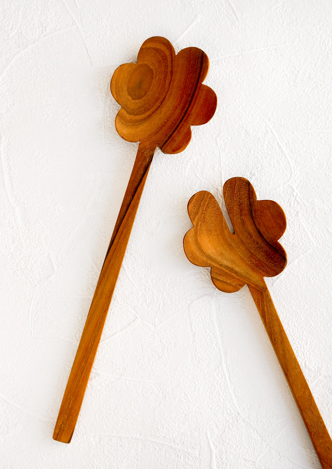 Pair of wooden, flower-shaped salad servers made from teak