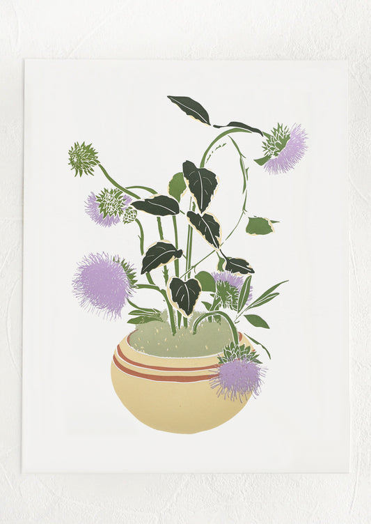 A letterpress printed art print of purple thistles in a vase.