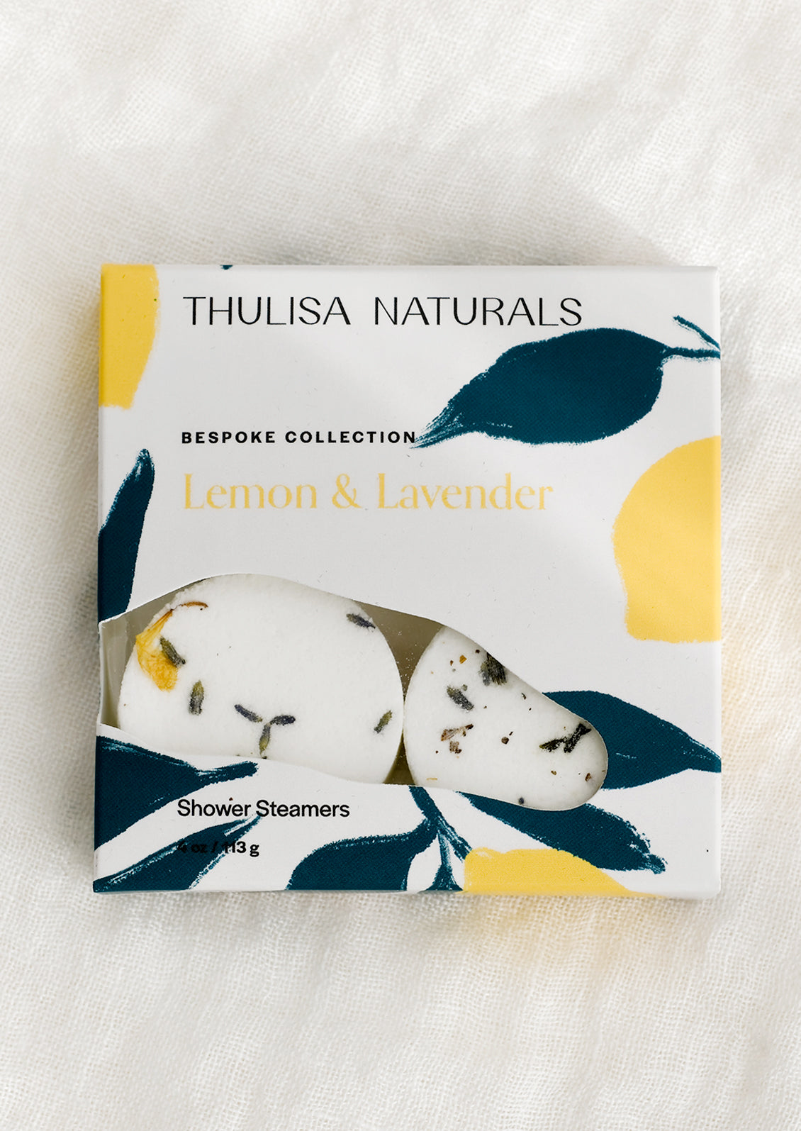 A box of shower steamer tablets in lemon & lavender scent.