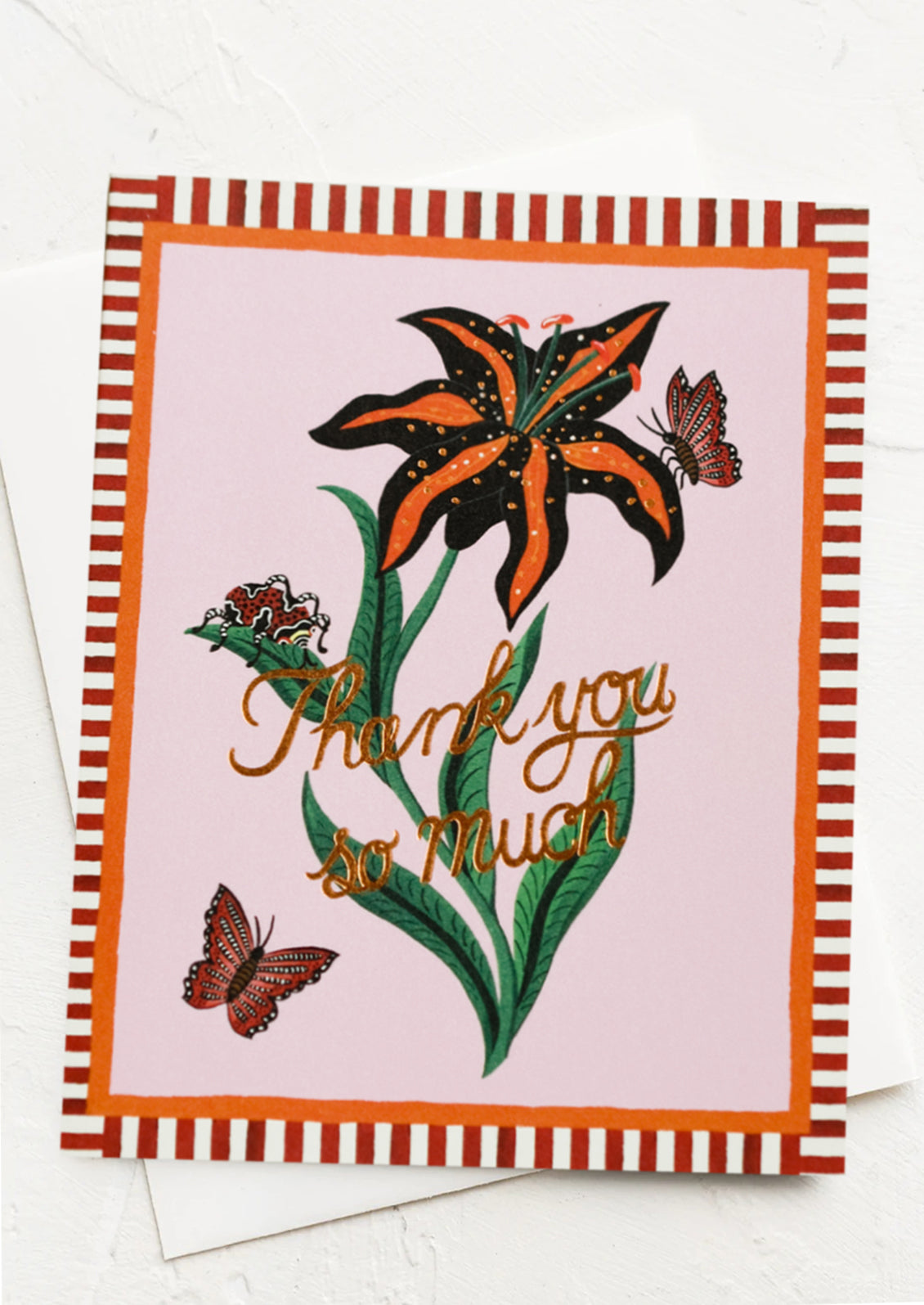 A tiger lily printed card with striped border reading "Thank you so much".
