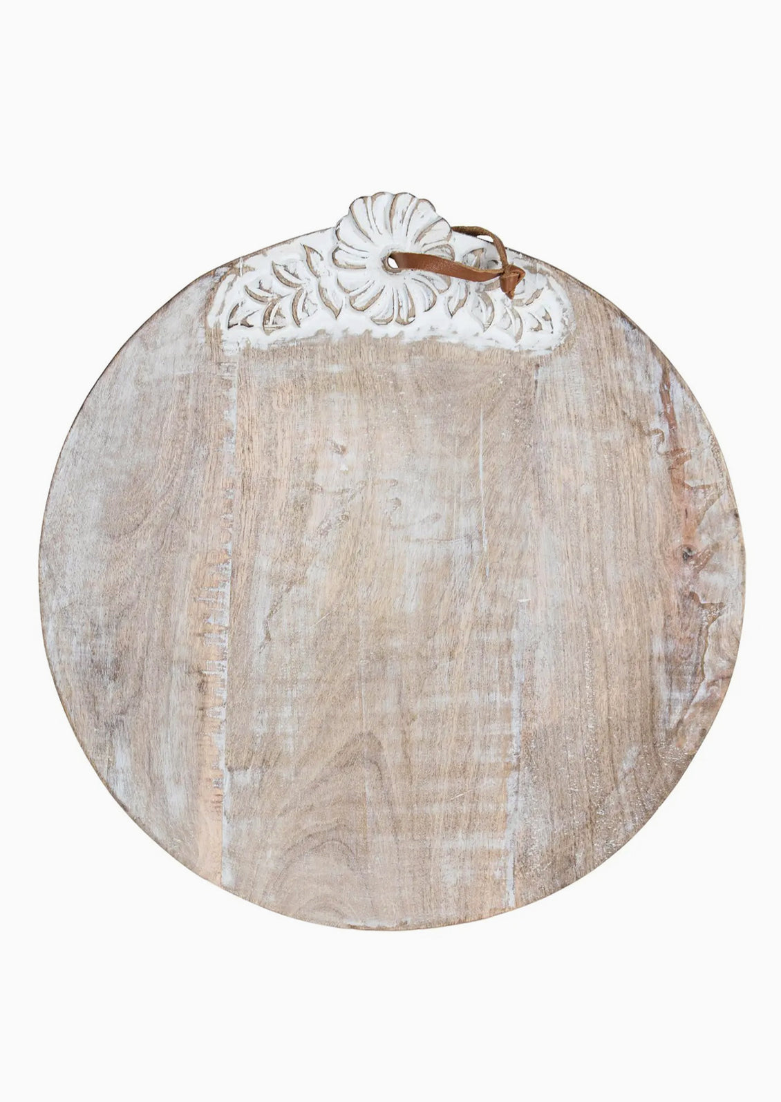 A round wooden cutting board with shabby chic floral detailing.