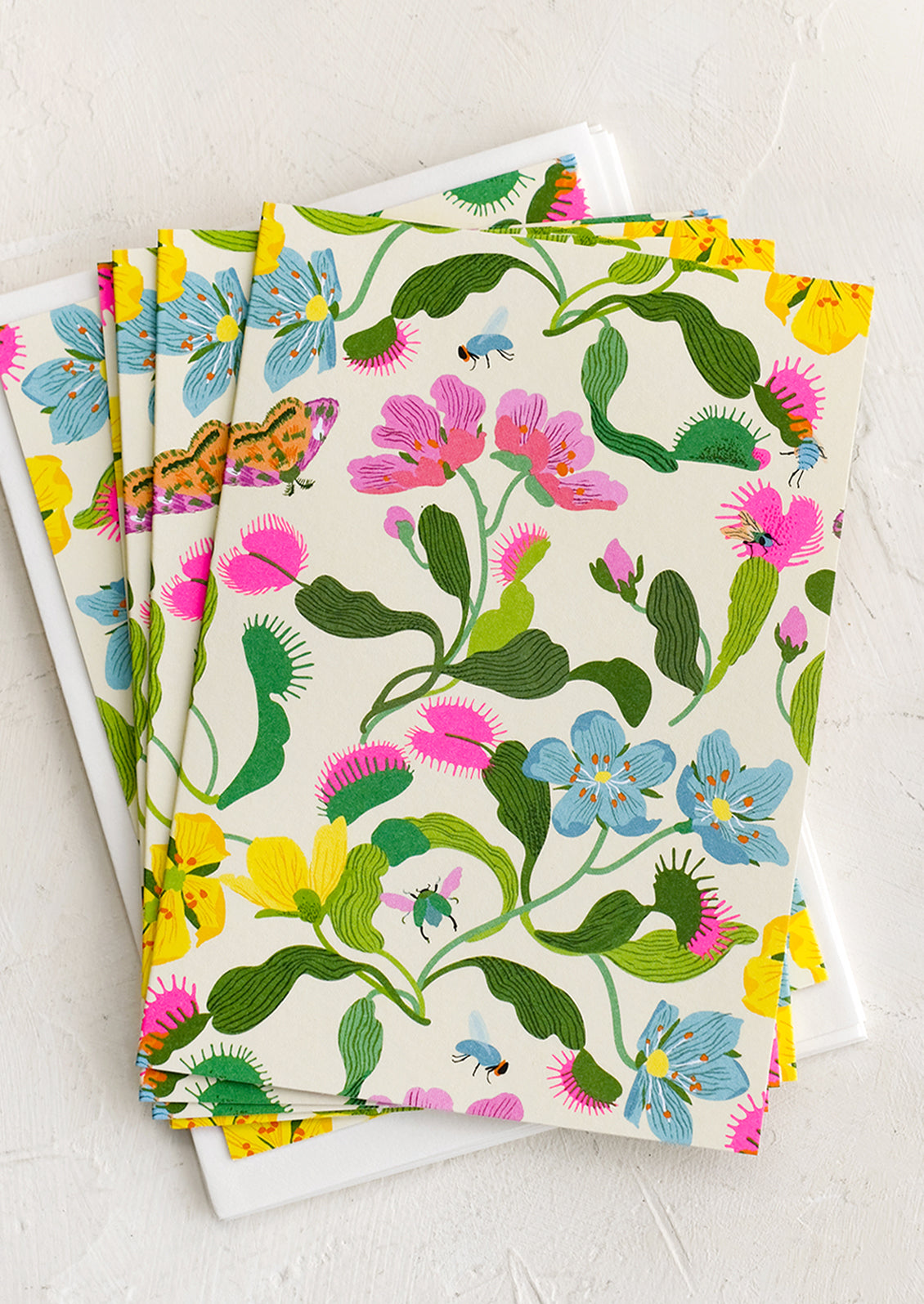 A set of notecards with colorful fly trap floral print.