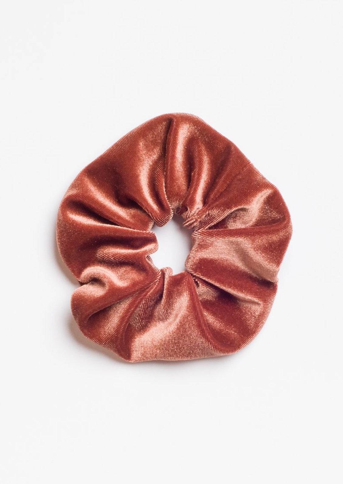 A velvet scrunchie in rust.