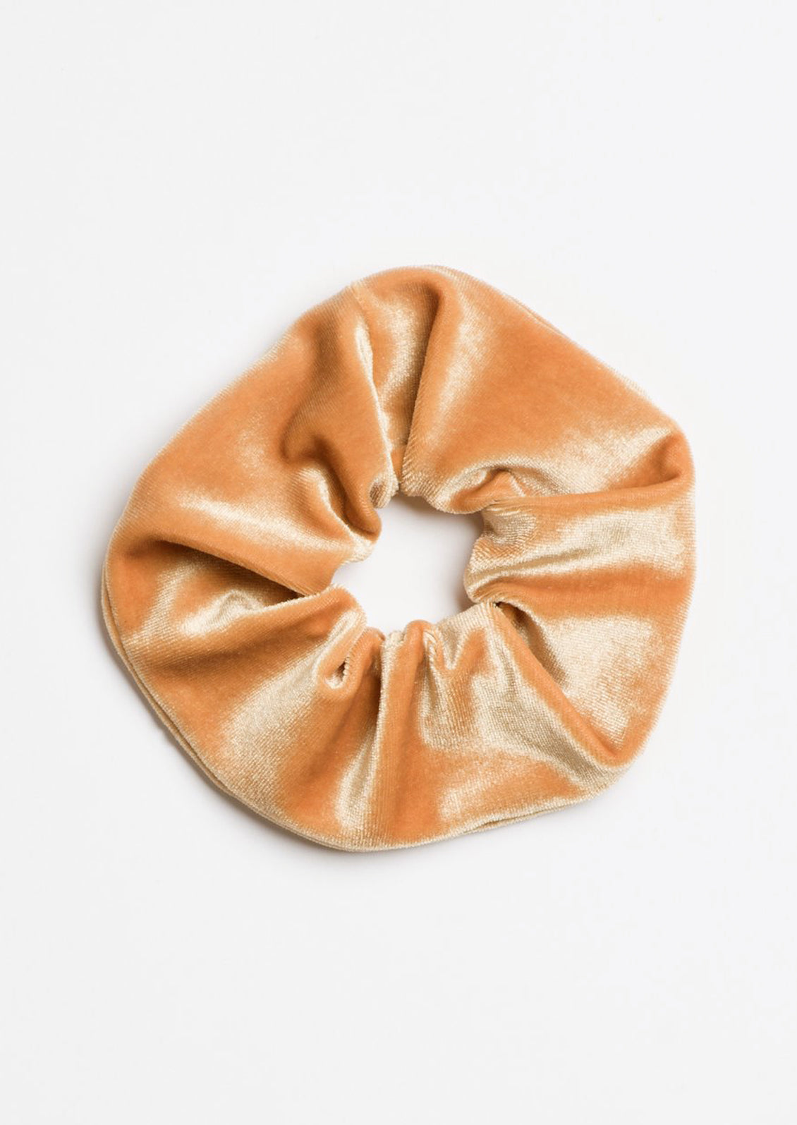 A velvet scrunchie in honey.