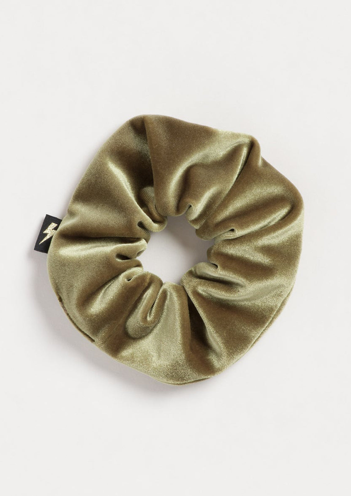 A velvet scrunchie in moss green.