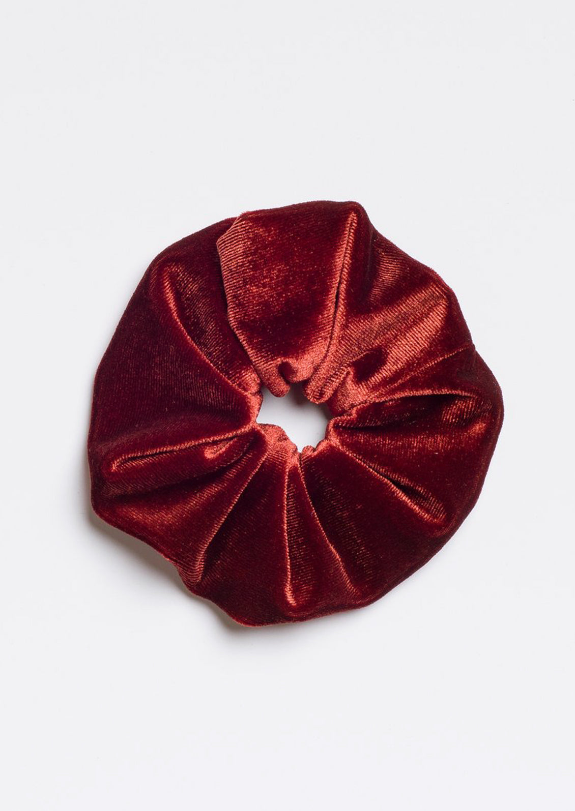 A velvet scrunchie in rust.