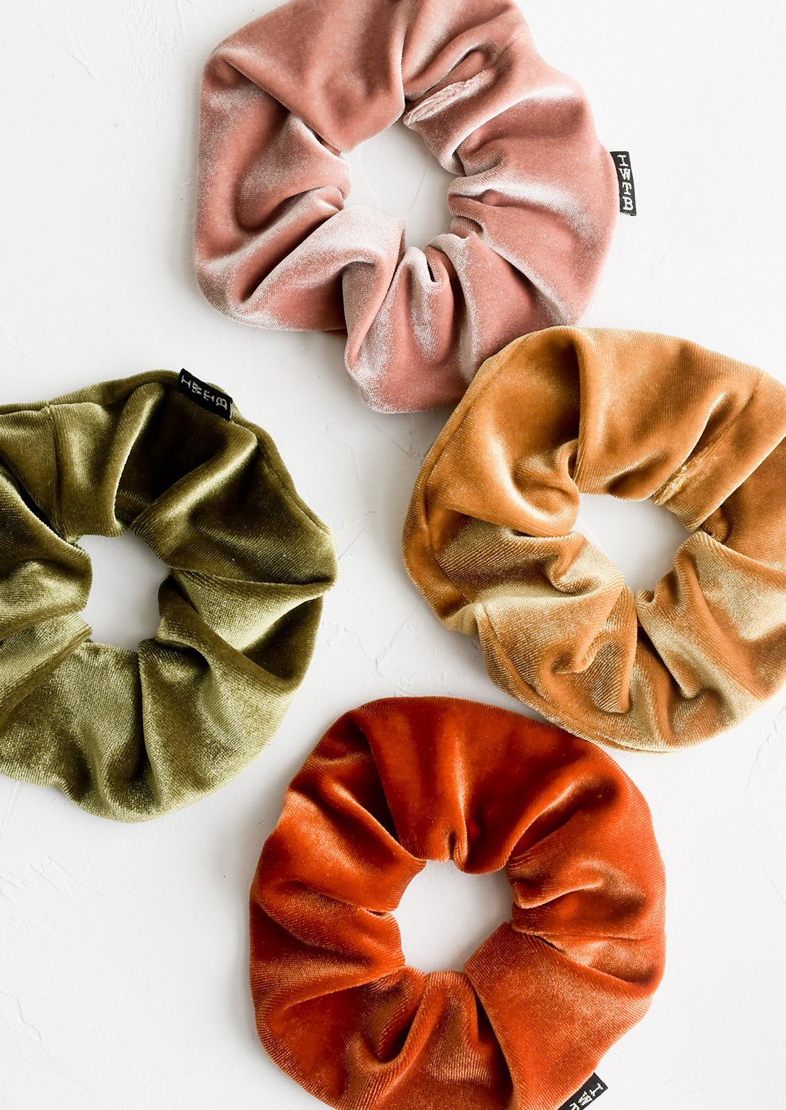 Velvet scrunchies in assorted colors.