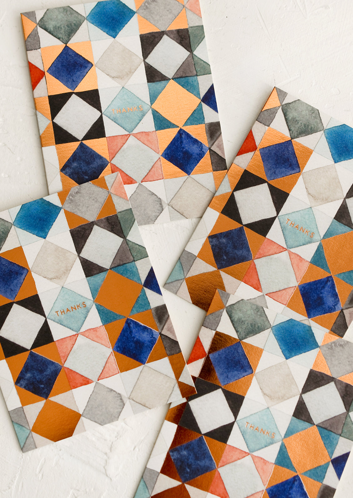 A set of blue and copper quilt print thank you cards.