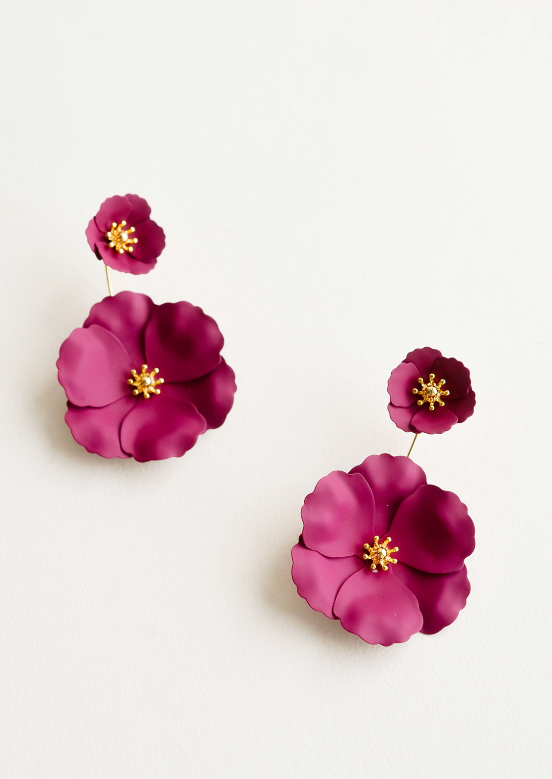 Two part berry and gold flower earrings with a small flower post and larger flower drop. 