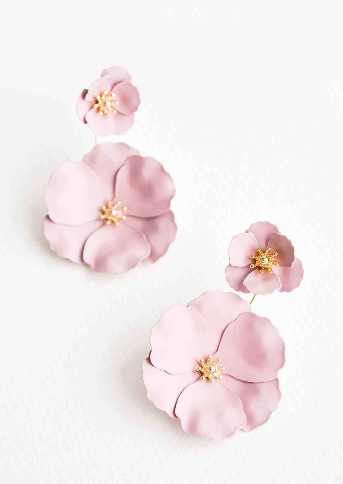 Two part lilac and gold flower earrings with a small flower post and larger flower drop. 