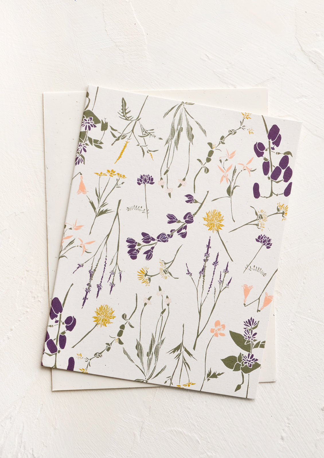 A greeting card with white background and floral print.